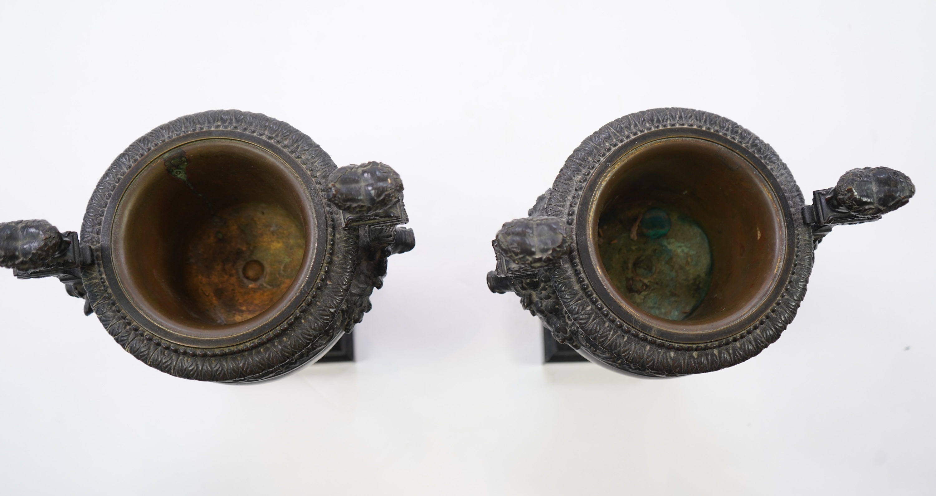 A pair of neoclassical revival bronze urns, late 19th century